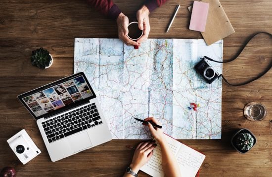 Two people planning travel Map