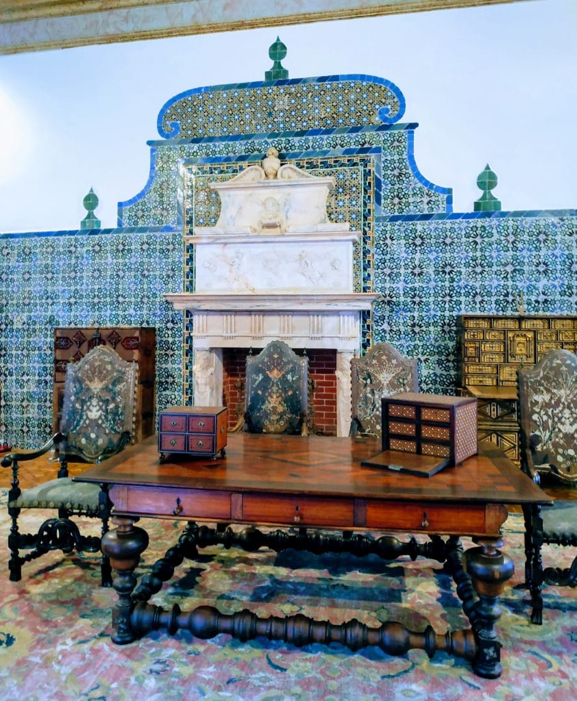 Wooden desk with tiled fireplace