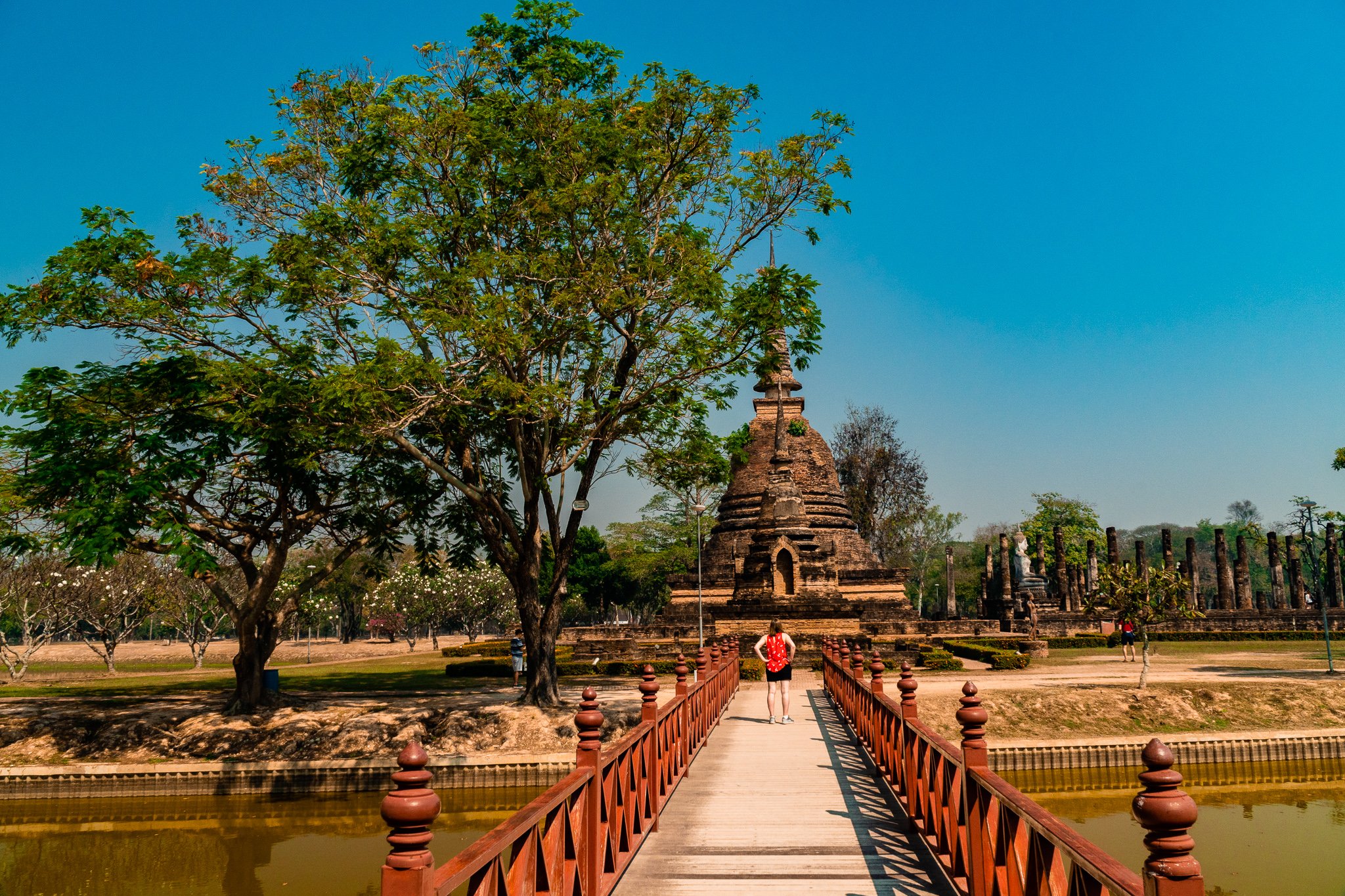 bridge over a river to see ancient Thai ruins