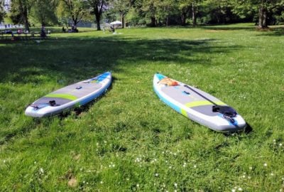 Two SUPs at Lake Sammamish Park on the grass