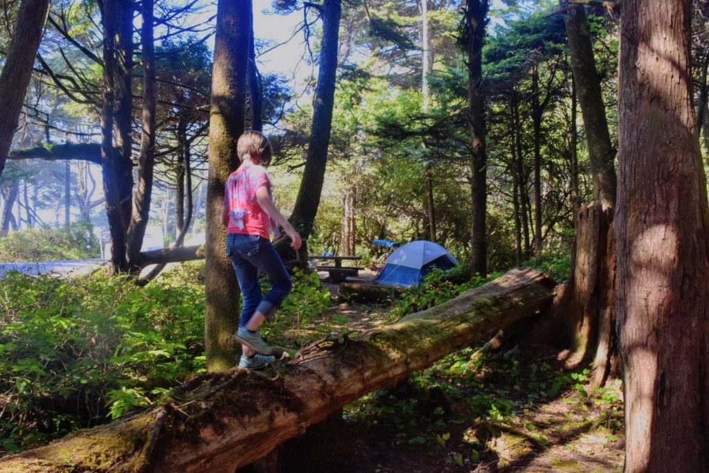 girl exploring area by campsite at Kalaloch Campground