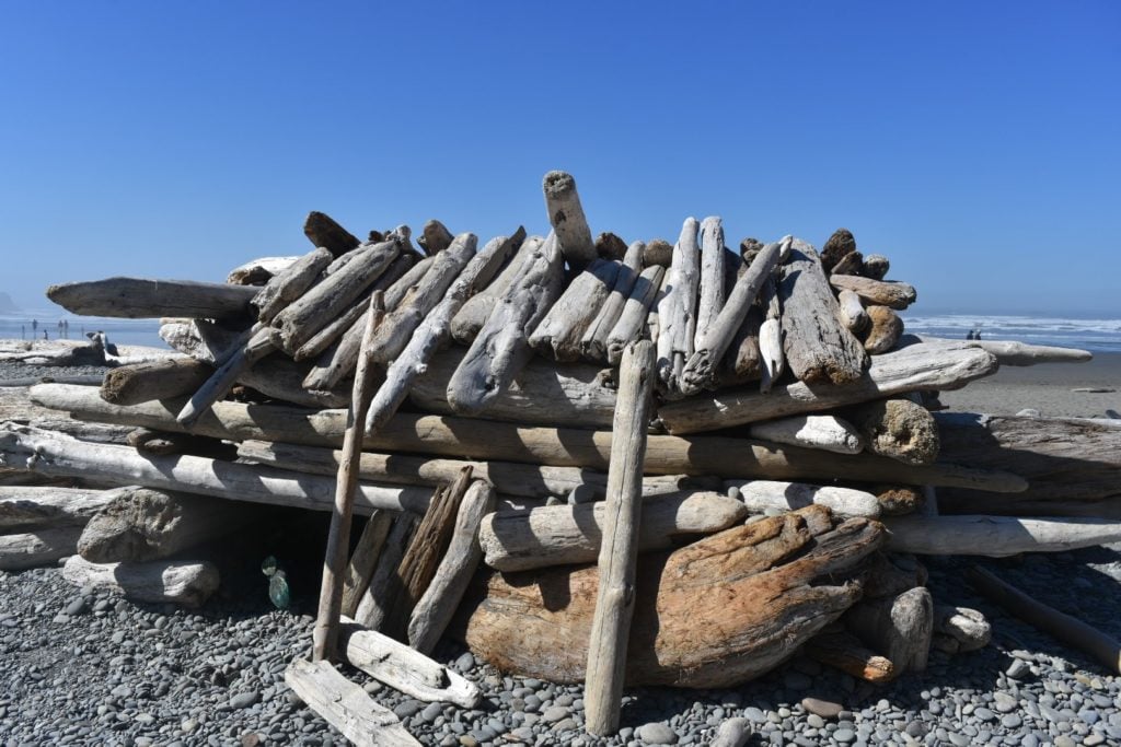 fort on the beach made from driftwood