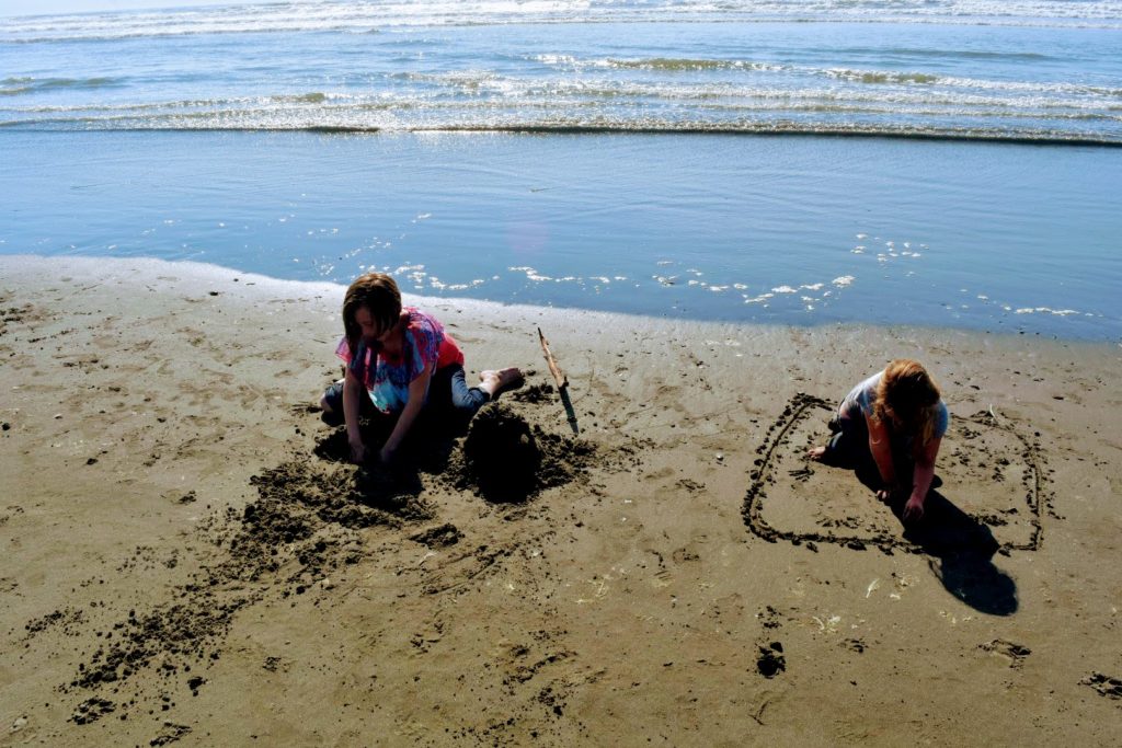 playing in the sand on the beach