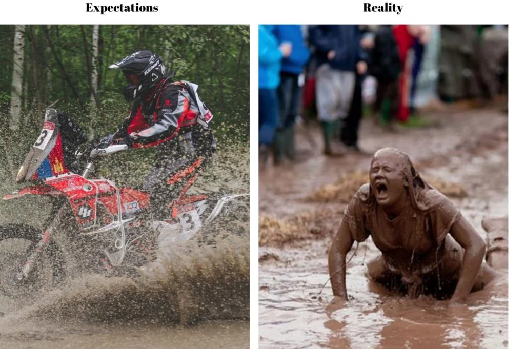 off road rider thru puddle with woman covered in mud