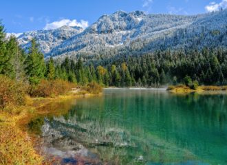 Gold Creek Pond with fall colors and snowy mountain