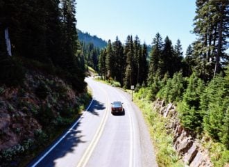 Car driving down road near Mt Rainier