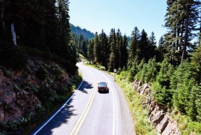 Car driving down road near Mt Rainier