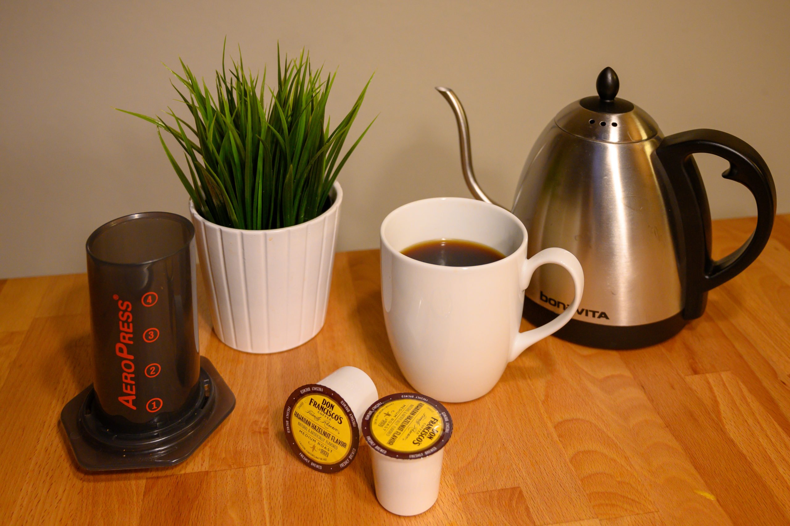 coffee with aeropress, k-cups and hot water kettle
