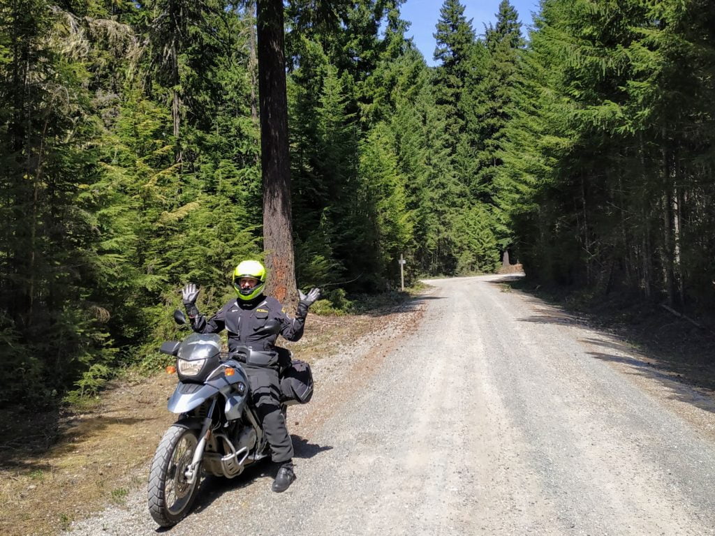motorcyclist on fs road in the mountains