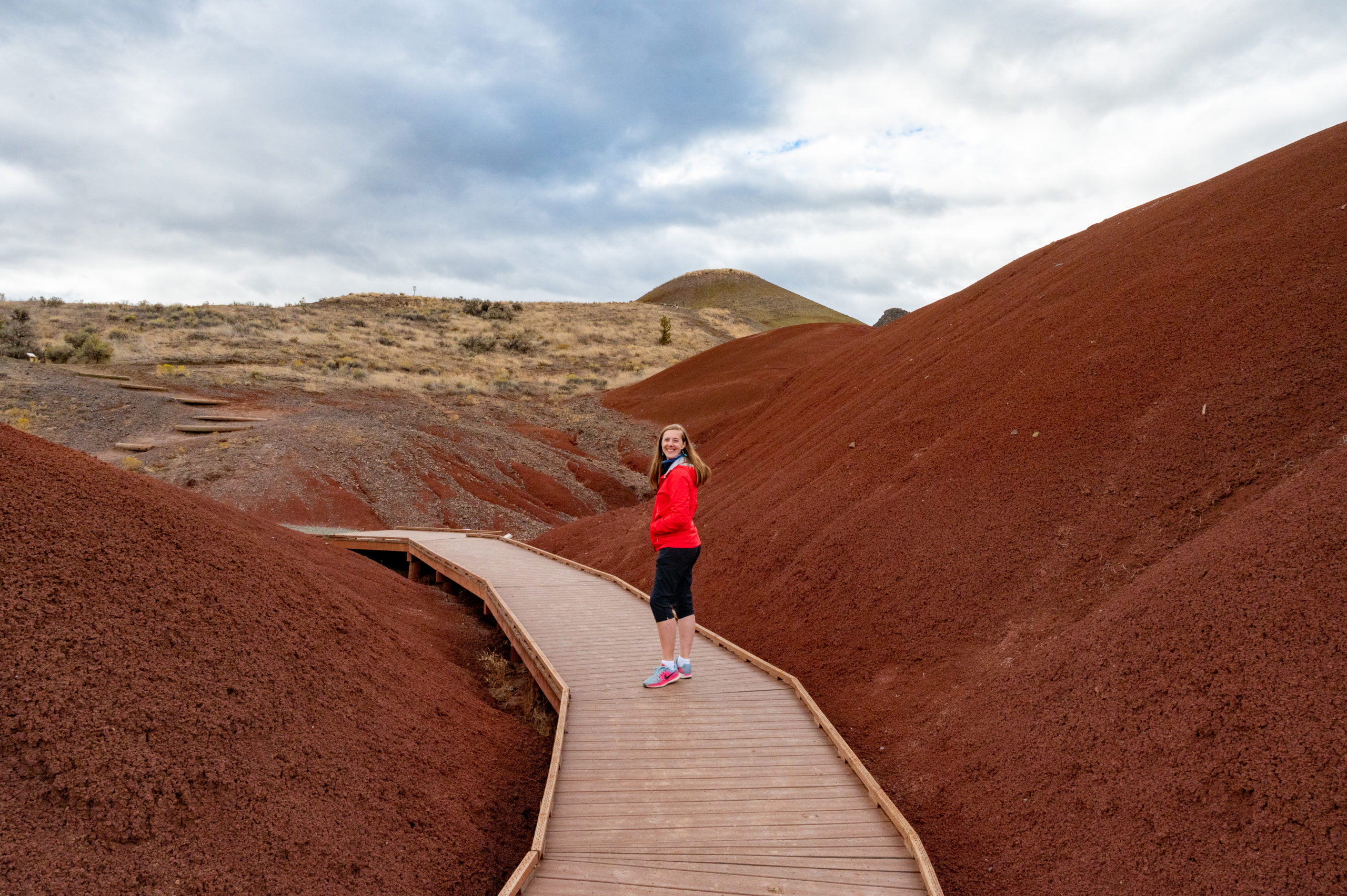 person walking on boardwalk at painted cove in the painted hills