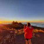 Photographer photographing sunset