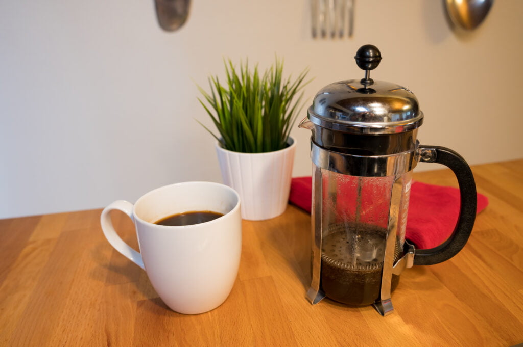 French Press Coffee and plant