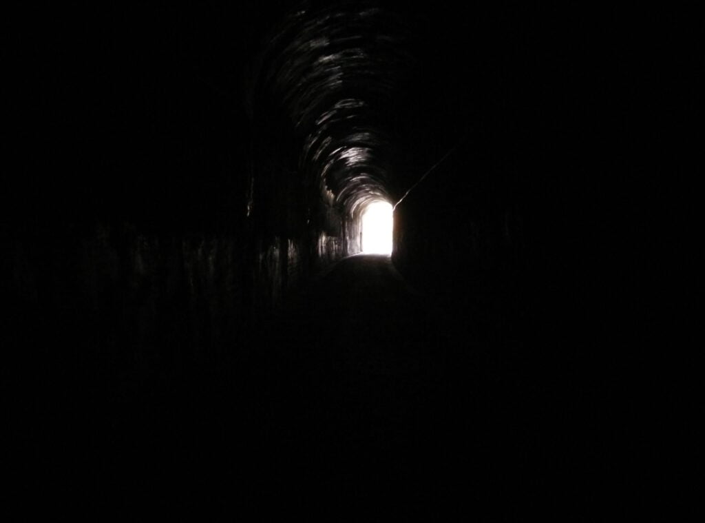 Dark tunnel with a light at the end
