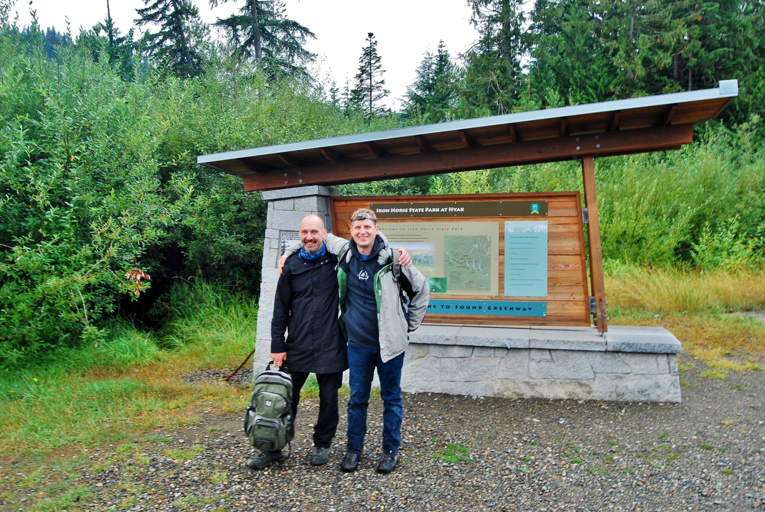 friends at trail sign