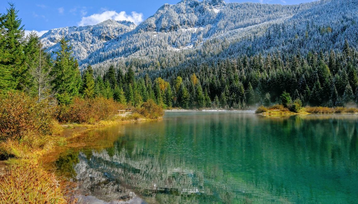 Gold Creek Pond with fall colors and snowy mountain