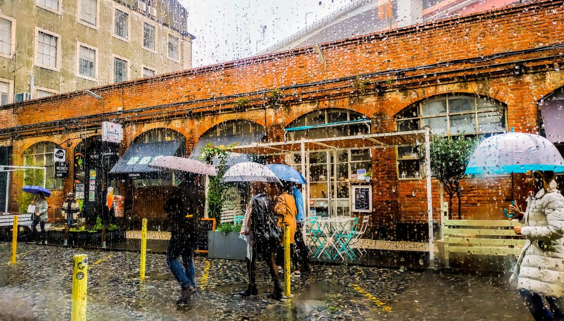 People with umbrellas in the rain