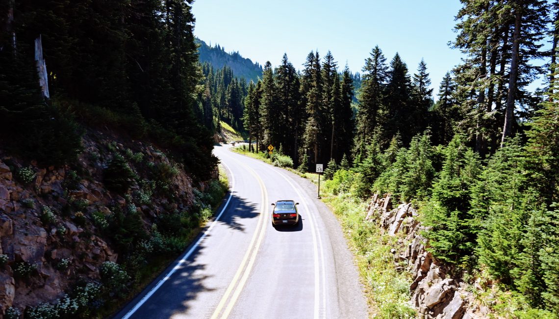 Car driving down road near Mt Rainier